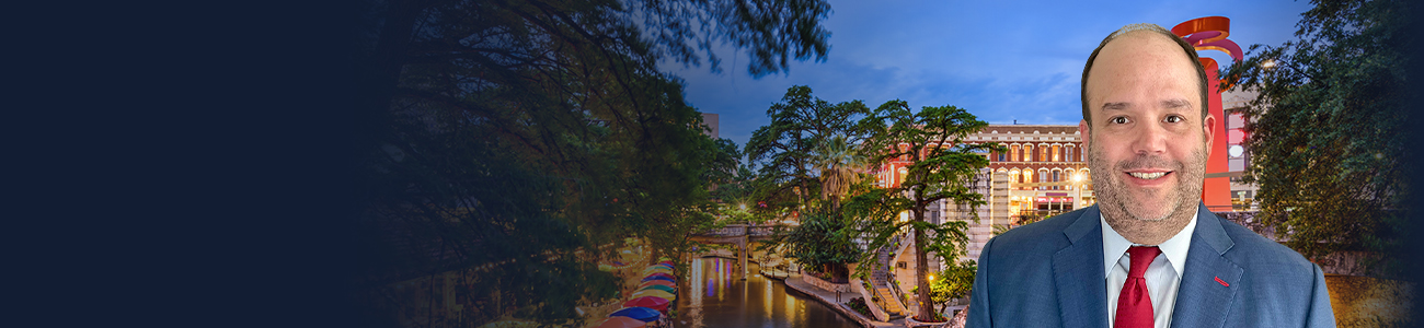 Robert Almonte II with the San Antonio river in the background